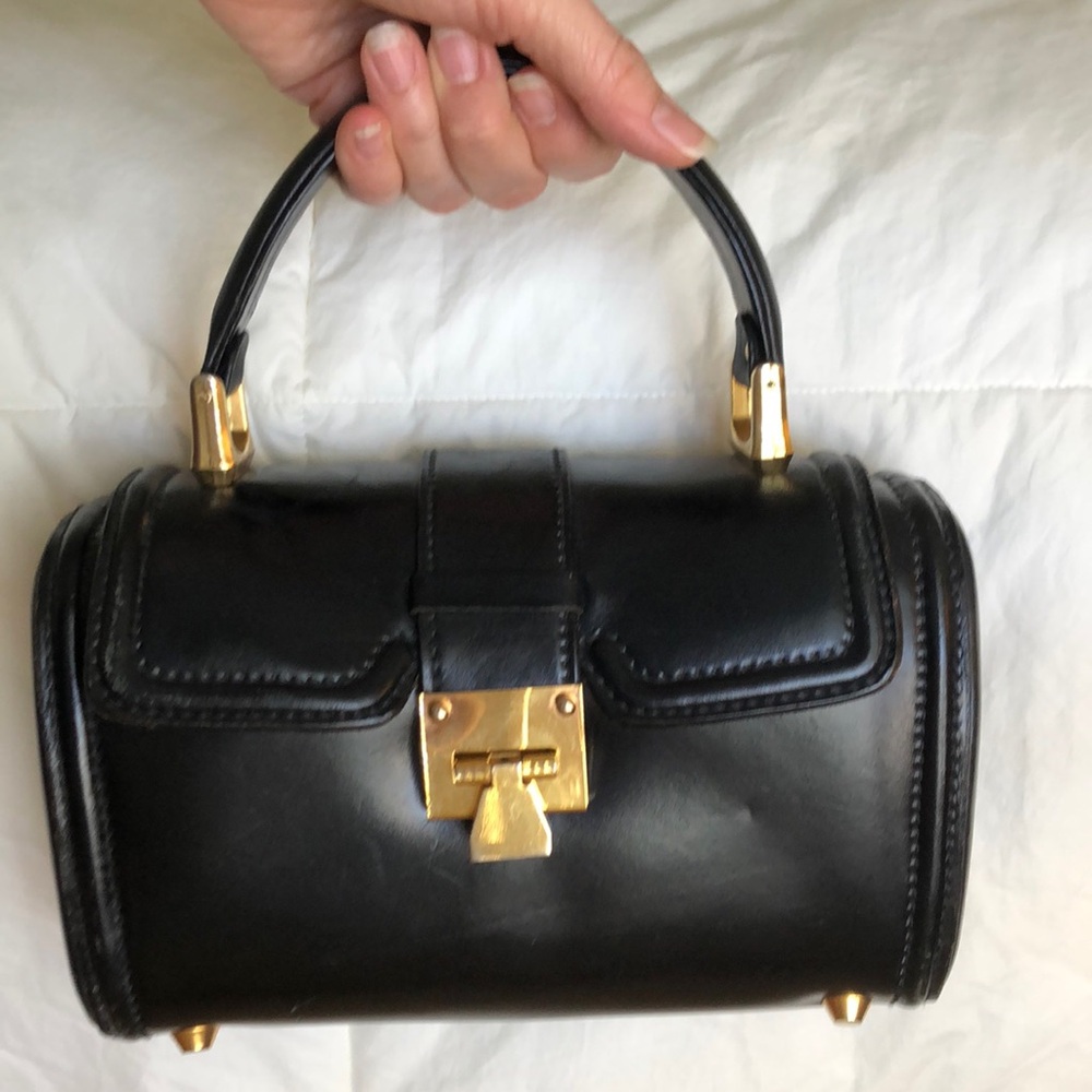 Beautiful classic black and gold barrel hand bag